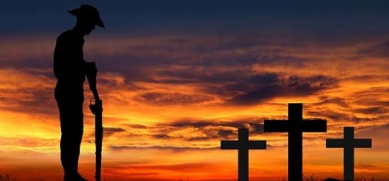 silhouette-of-an-anzac-soldier-with-his-head-bowed-against-a-sunrise-top.jpg